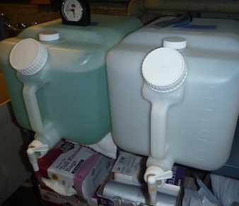 5 gallon containers with spigots.
